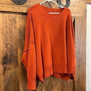 Oversized exposed hem sweater